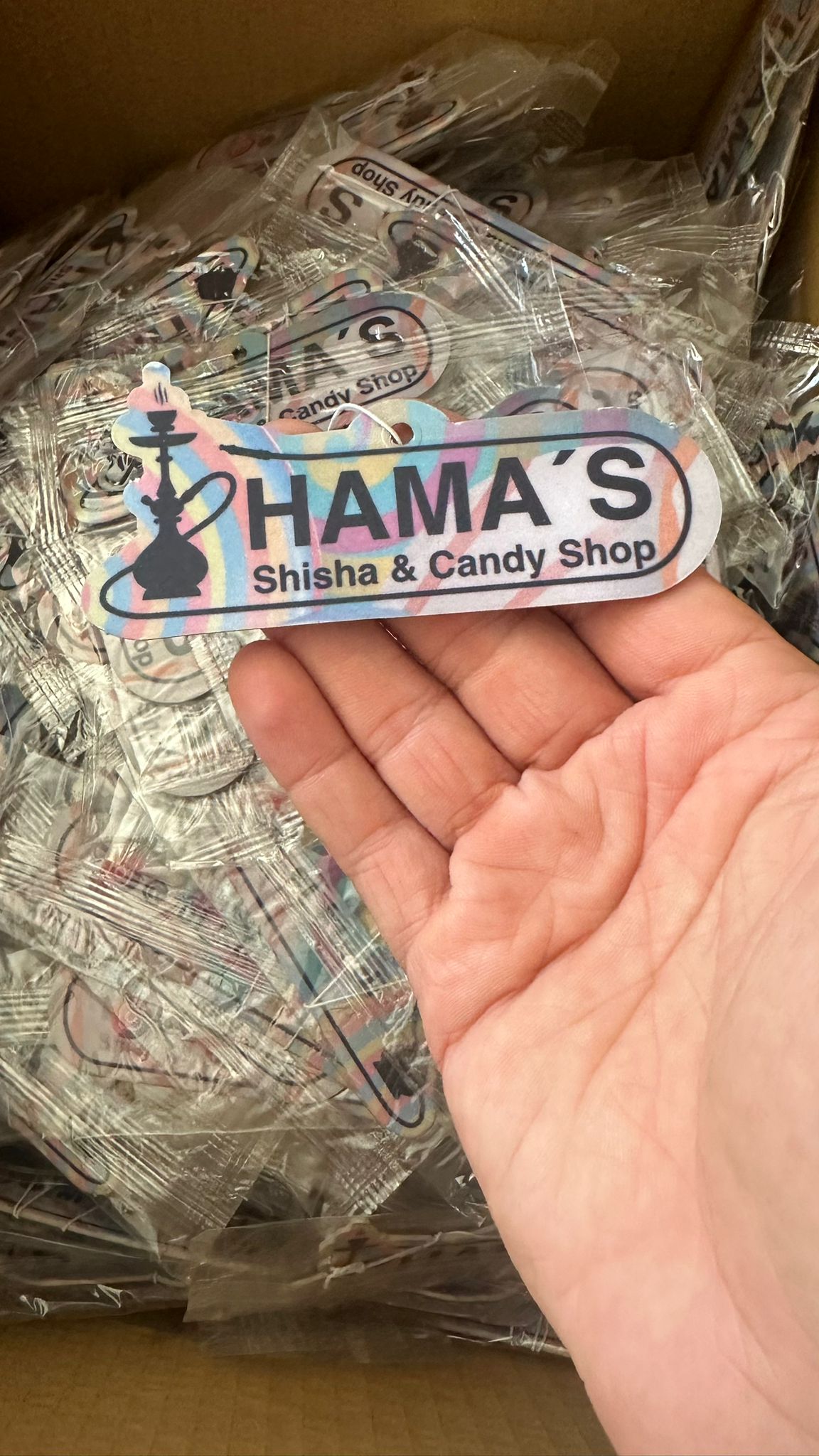 Custom air fresheners with multiple design options, showcasing vibrant colors and unique logos