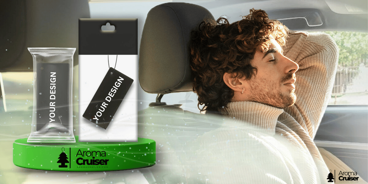 Men sit in car and with his custom Air fresheners from AromaCruiser.com